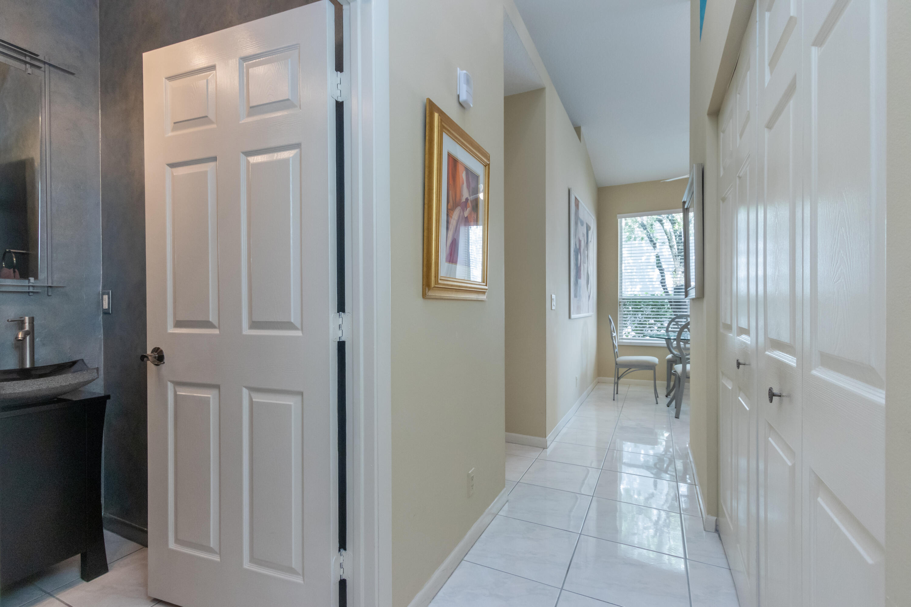 23402 Torre Circle Boca Raton, FL 33433 - Photo 30 of 44 a bathroom with a sink and a mirror
