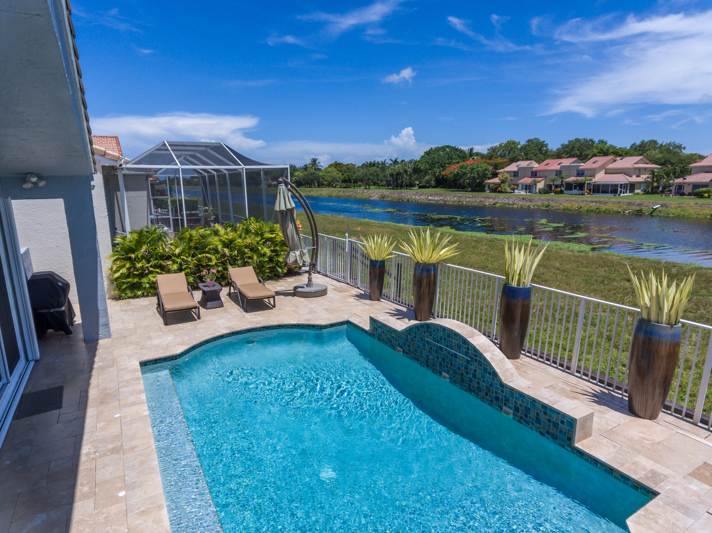 23402 Torre Circle Boca Raton, FL 33433 - Photo 34 of 44 a view of a balcony with lake view and a potted plant