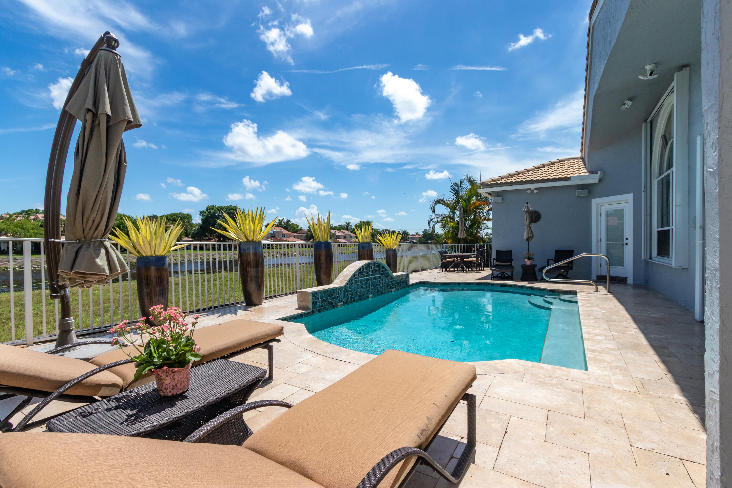 23402 Torre Circle Boca Raton, FL 33433 - Photo 4 of 44 a view of a patio with swimming pool