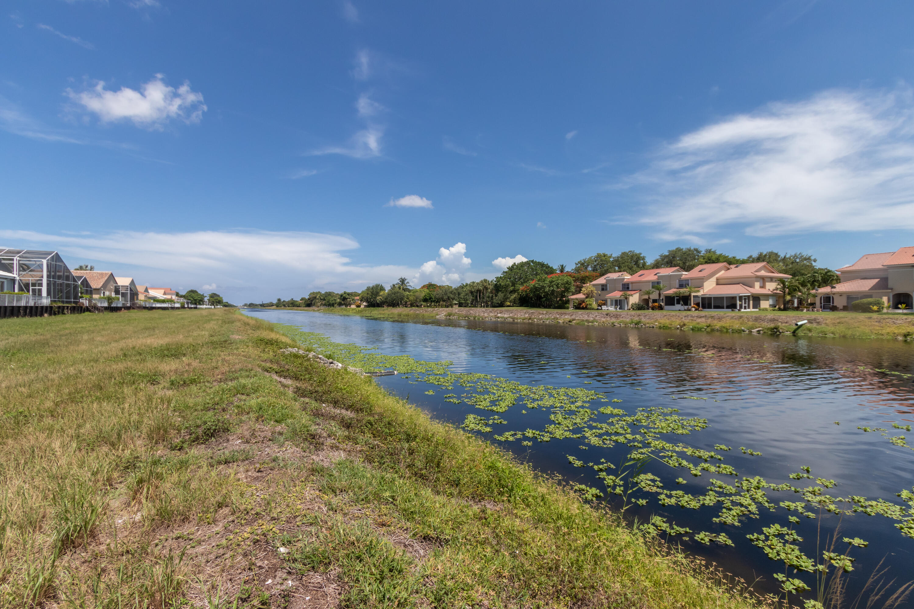 23402 Torre Circle Boca Raton, FL 33433 - Photo 44 of 44 a view of a lake with houses in the back