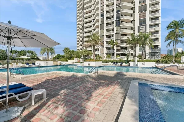 a view of a swimming pool with a patio