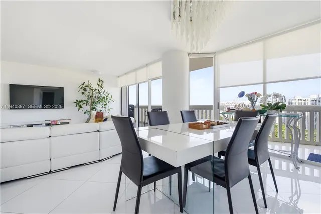 a view of a dining room with furniture and window