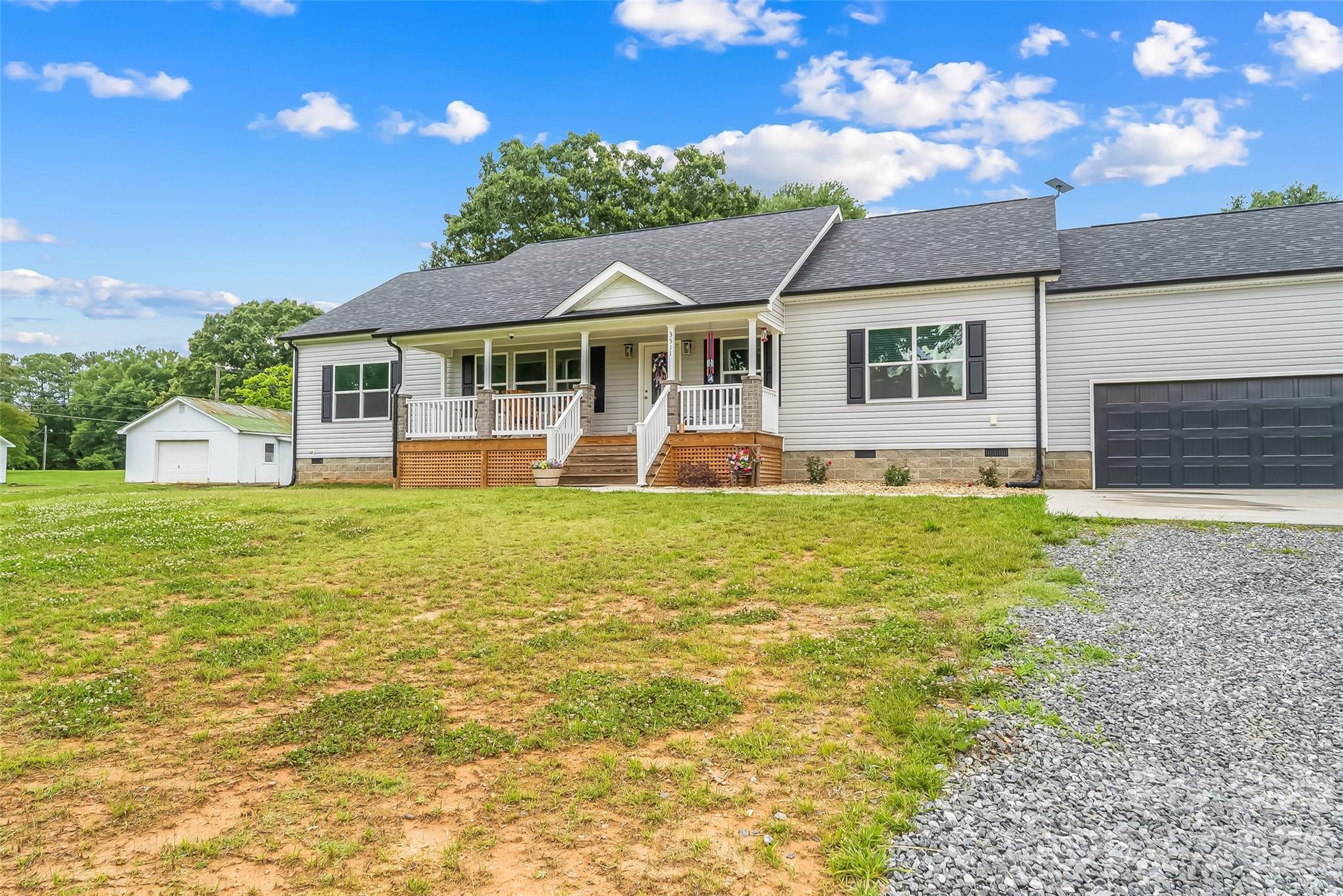 3511 Randleman Road Iron Station, NC 28080 - Photo 3 of 31 a front view of a house with a yard