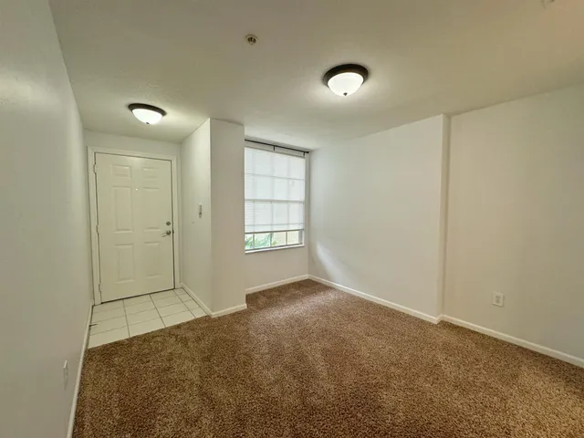 a view of an empty room with a window