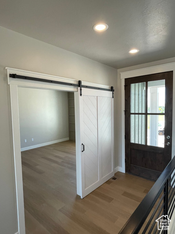 658 West 500 South Logan, UT 84321 - Photo 17 of 25 Foyer featuring recessed lighting, wood finished floors, and a barn door