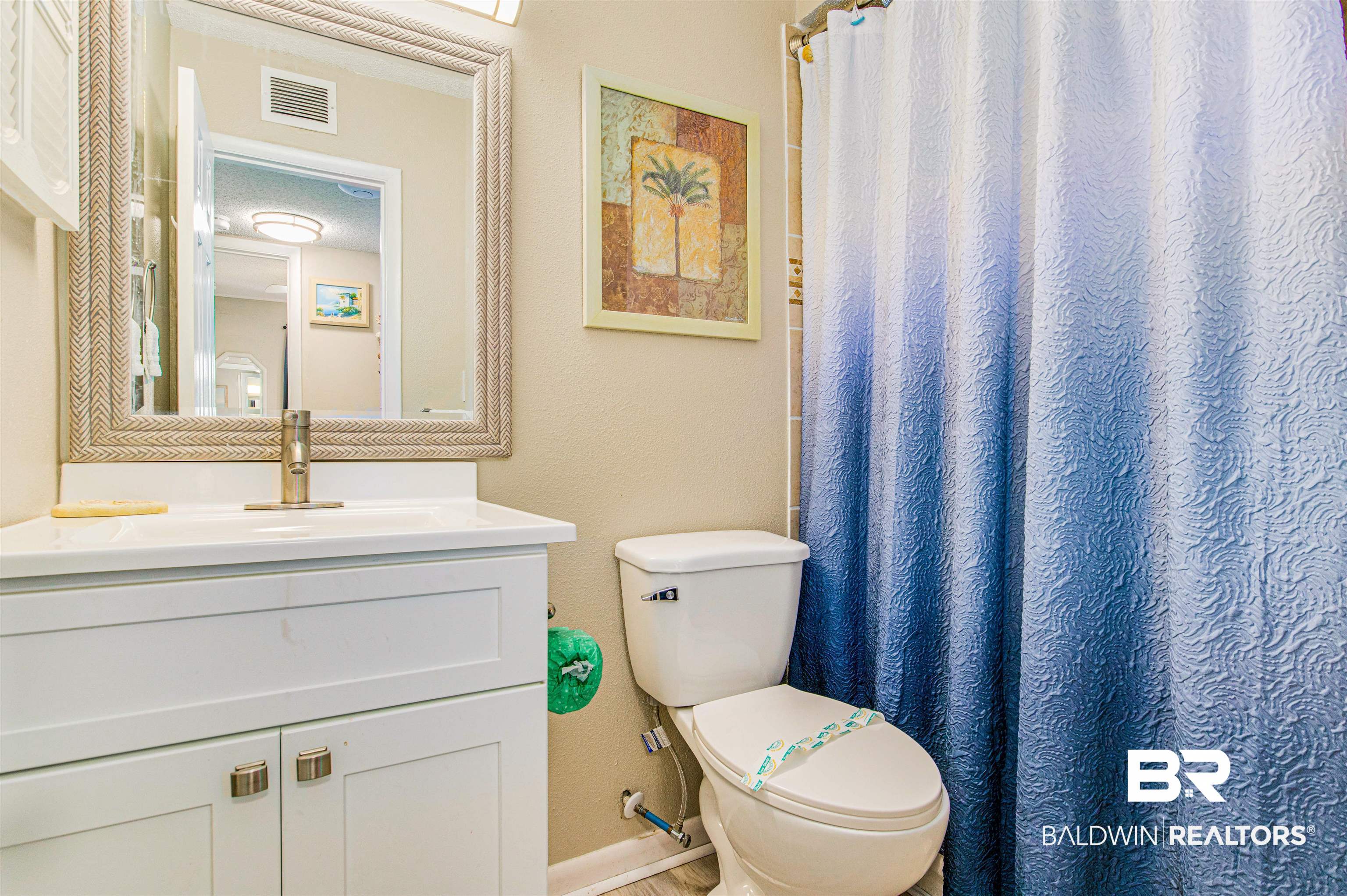 400 Plantation Road, Unit 1303 Gulf Shores, AL 36542 - Photo 10 of 24 Bathroom with vanity, toilet, and tub/shower combo