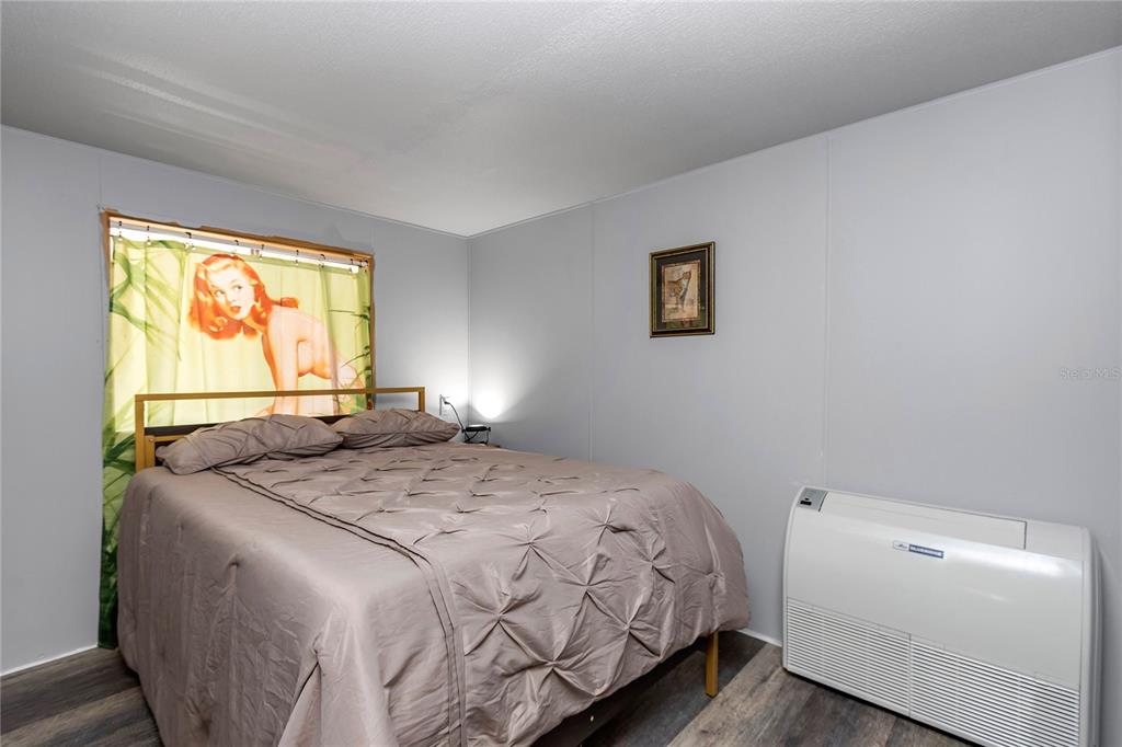 3003 Northeast 165th Lane Citra, FL 32113 - Photo 17 of 40 a bedroom with a bed and a window