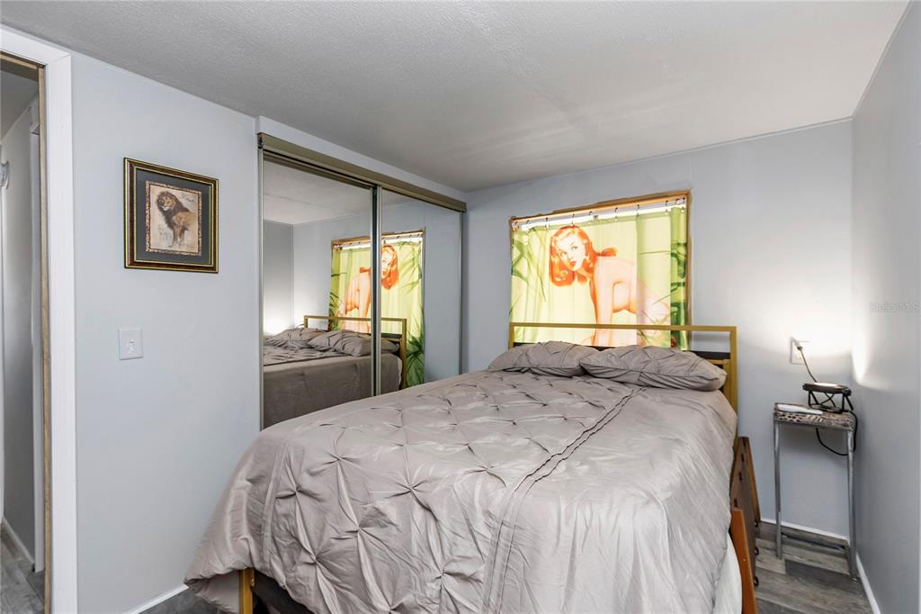 3003 Northeast 165th Lane Citra, FL 32113 - Photo 18 of 40 a bedroom with a bed and a window