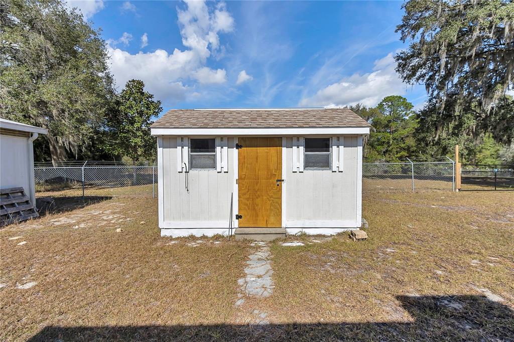 3003 Northeast 165th Lane Citra, FL 32113 - Photo 24 of 40 a view of a house with a yard