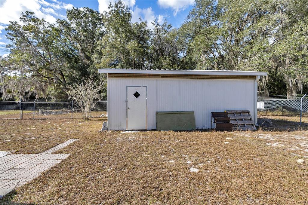 3003 Northeast 165th Lane Citra, FL 32113 - Photo 27 of 40 a view of a house with a yard