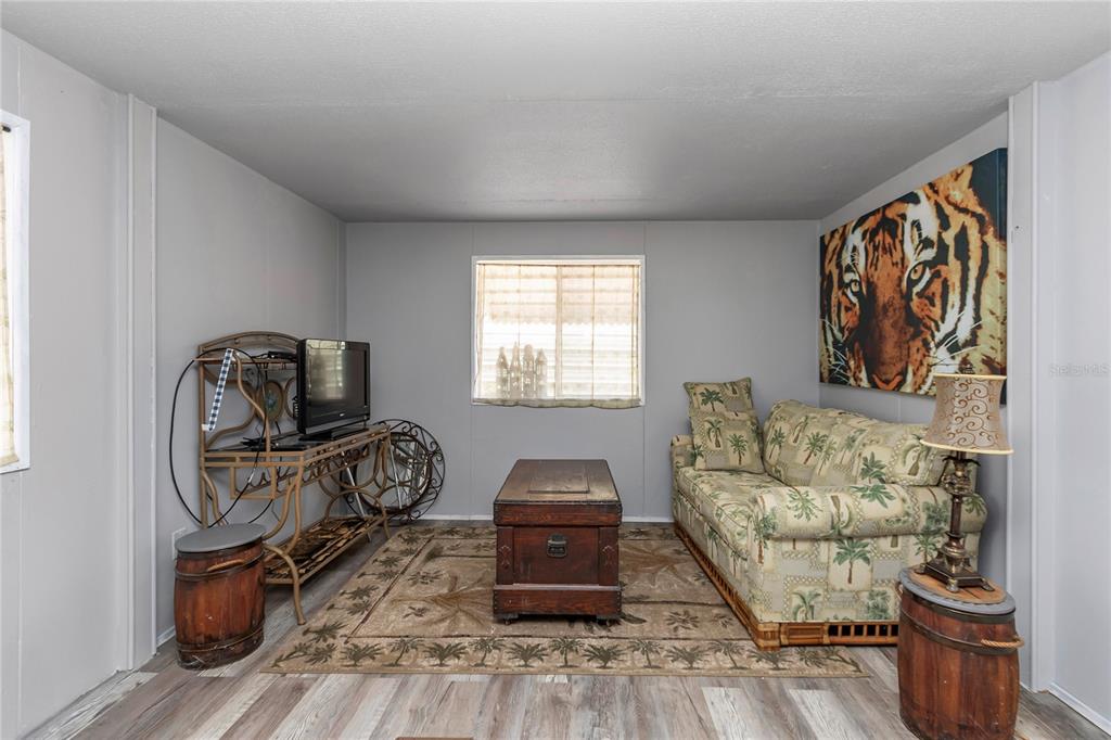 3003 Northeast 165th Lane Citra, FL 32113 - Photo 9 of 40 a bedroom with furniture and a window