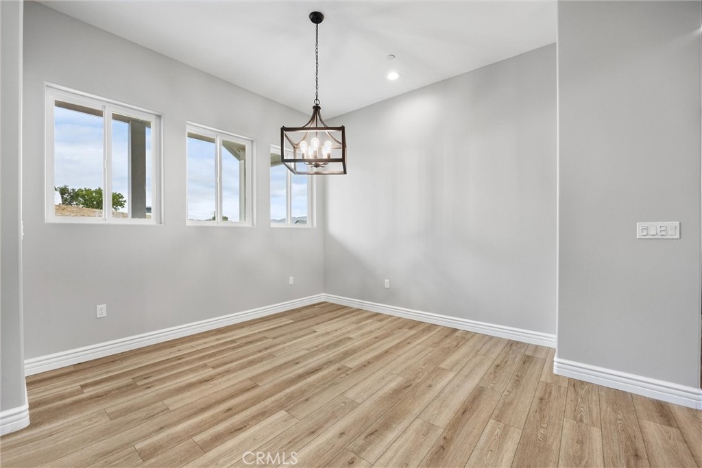 21116 Stage Drive Tehachapi, CA 93561 - Photo 11 of 46 a view of empty room with wooden floor
