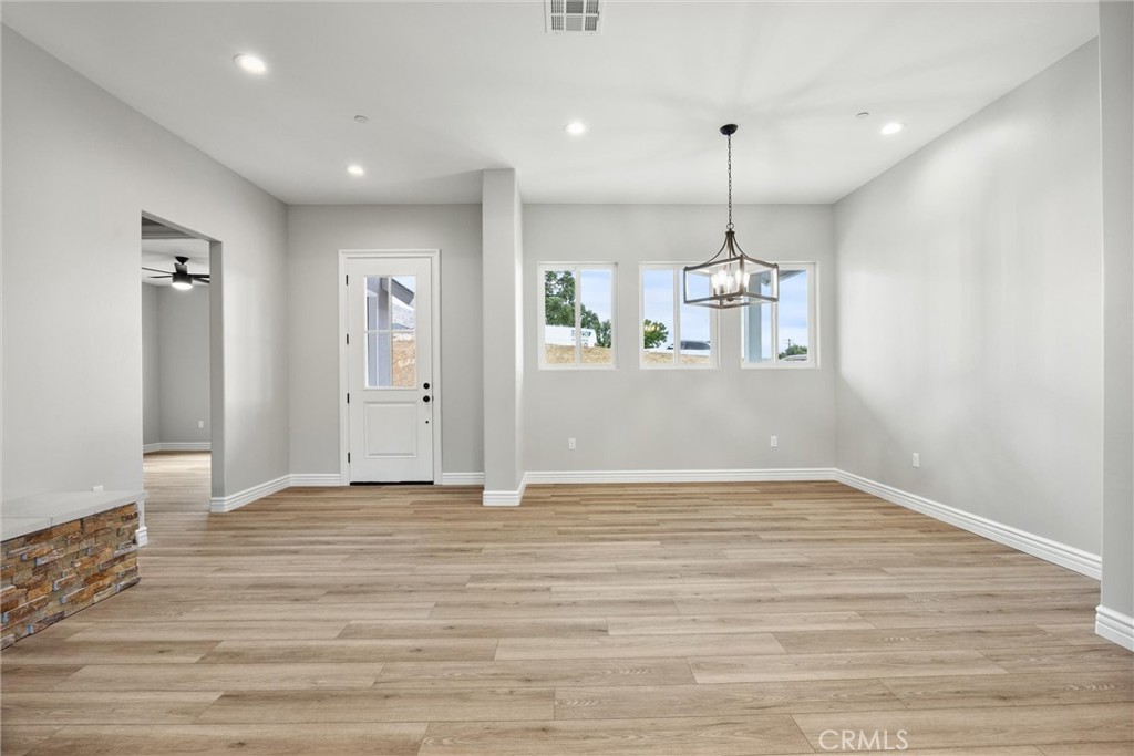 21116 Stage Drive Tehachapi, CA 93561 - Photo 12 of 46 a view of an empty room with kitchen and window