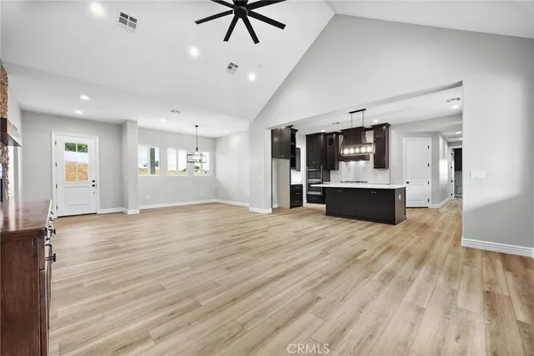 a view of a kitchen with a stove cabinets and wooden floor