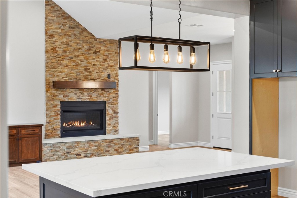 21116 Stage Drive Tehachapi, CA 93561 - Photo 19 of 46 a room with a fireplace a sink and a fireplace