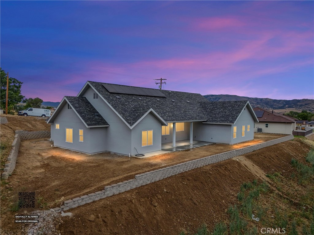 21116 Stage Drive Tehachapi, CA 93561 - Photo 2 of 46 a front view of a house with a yard