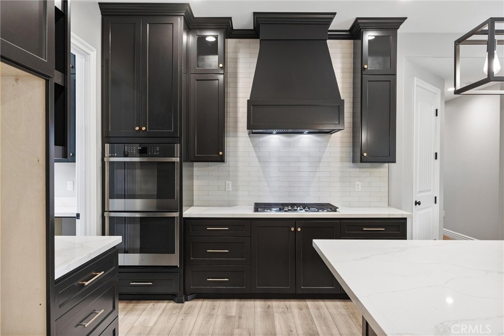 21116 Stage Drive Tehachapi, CA 93561 - Photo 21 of 46 a kitchen with a refrigerator and cabinets