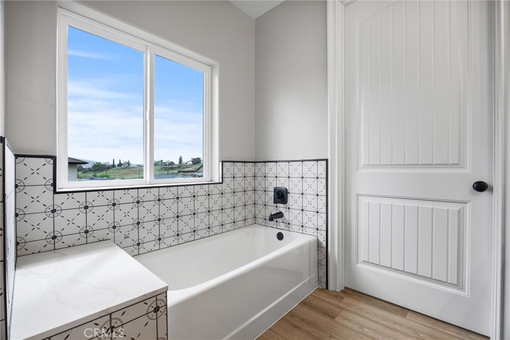 21116 Stage Drive Tehachapi, CA 93561 - Photo 30 of 46 a bathroom with a bathtub and next to a window