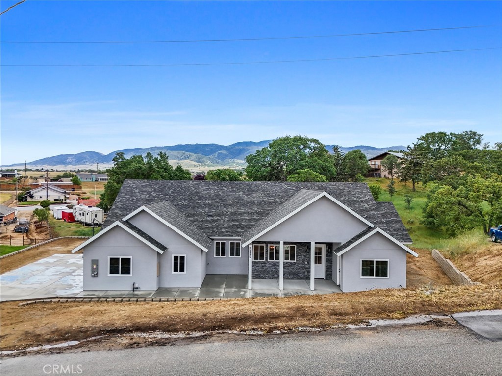21116 Stage Drive Tehachapi, CA 93561 - Photo 3 of 46 a view of a house with a big yard and large trees