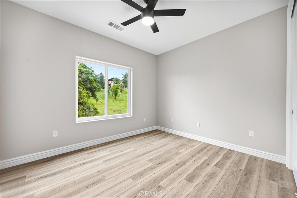 21116 Stage Drive Tehachapi, CA 93561 - Photo 33 of 46 wooden floor in an empty room with a window