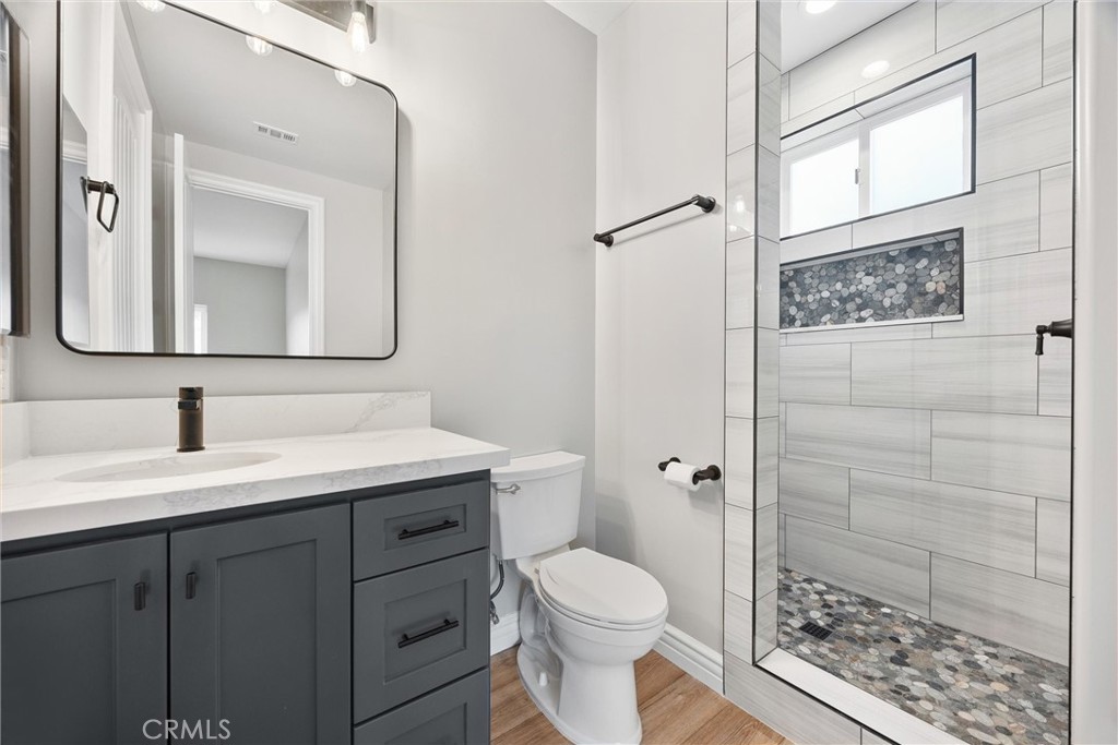 21116 Stage Drive Tehachapi, CA 93561 - Photo 35 of 46 a bathroom with a sink a toilet and shower