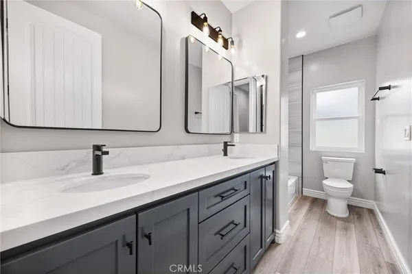 a bathroom with a toilet and shower