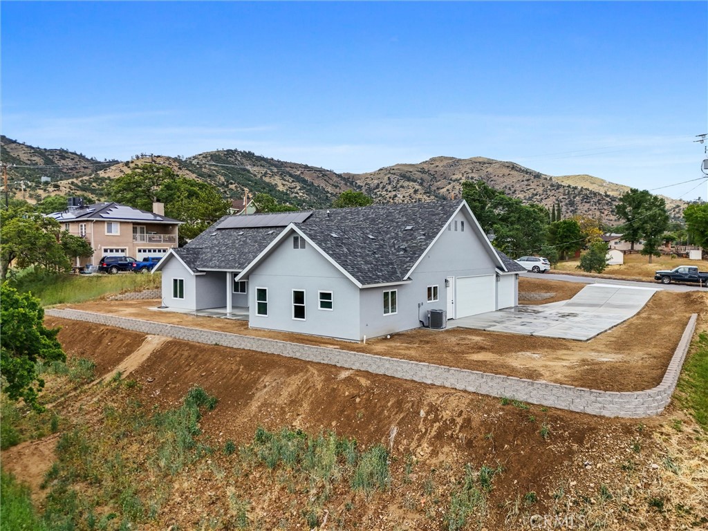 21116 Stage Drive Tehachapi, CA 93561 - Photo 5 of 46 a view of a house with a outdoor space