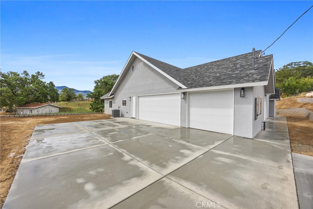21116 Stage Drive Tehachapi, CA 93561 - Photo 7 of 46 a view of a house with a yard and garage