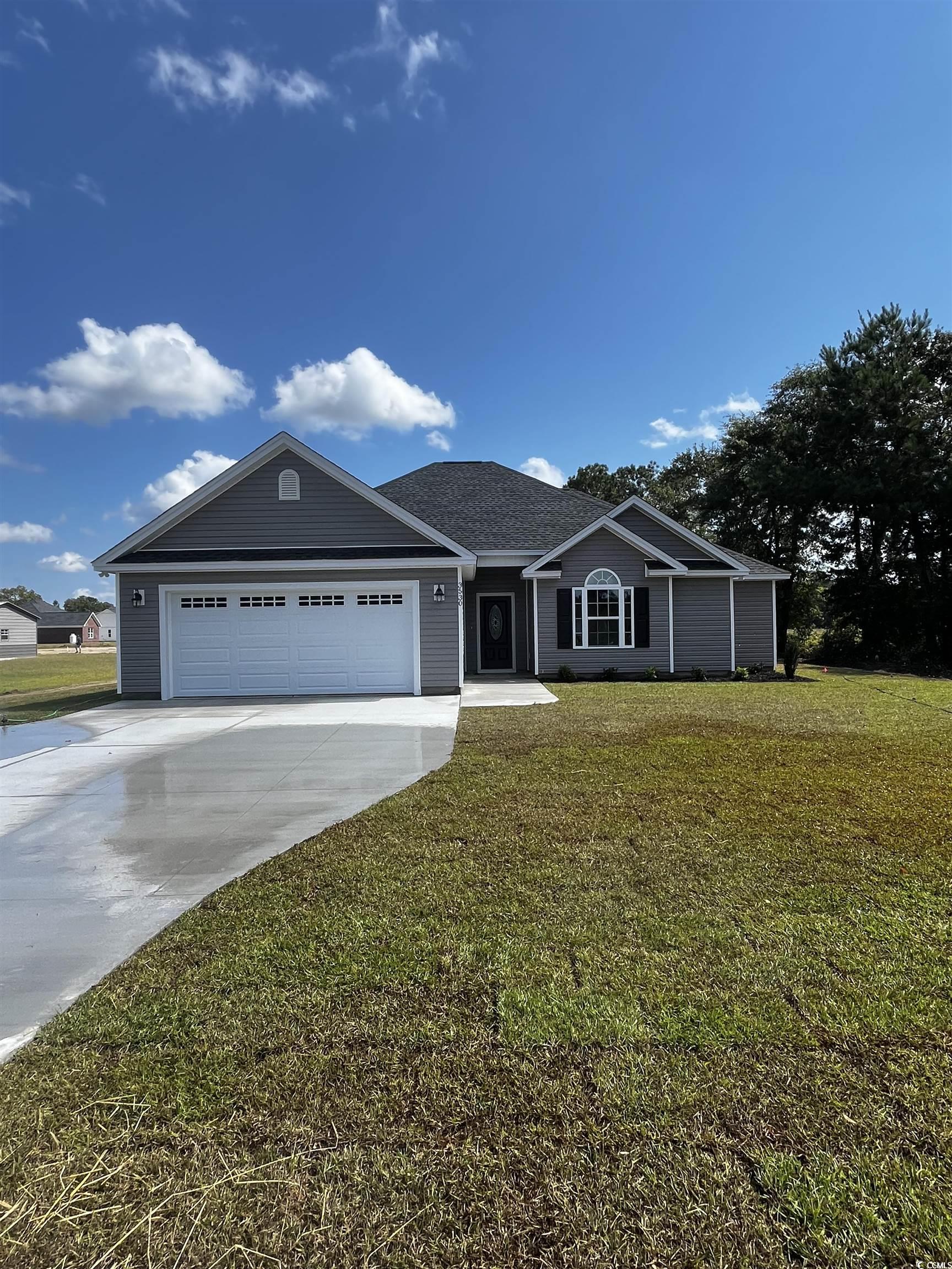 3530 Good Luck Road Aynor, SC 29511 - Photo 1 of 8 Ranch-style home featuring concrete driveway, a front yard, and a garage