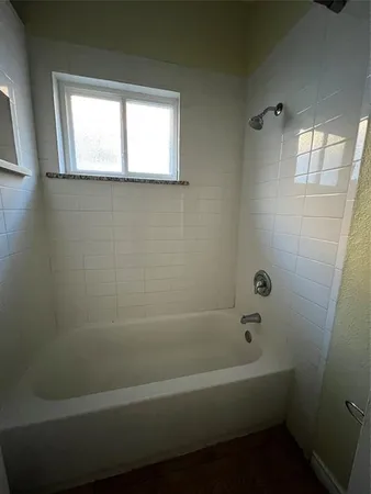 a white toilet sitting in a bathroom