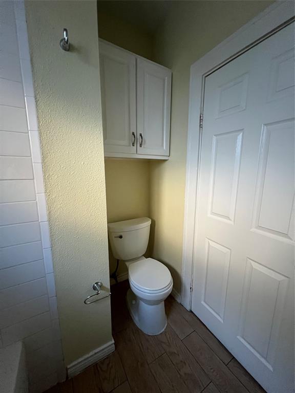 200 East 12th Street Dallas, TX 75203 - Photo 13 of 14 a white toilet sitting in a bathroom