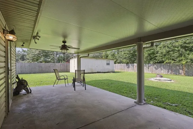 a view of a porch with furniture and yard