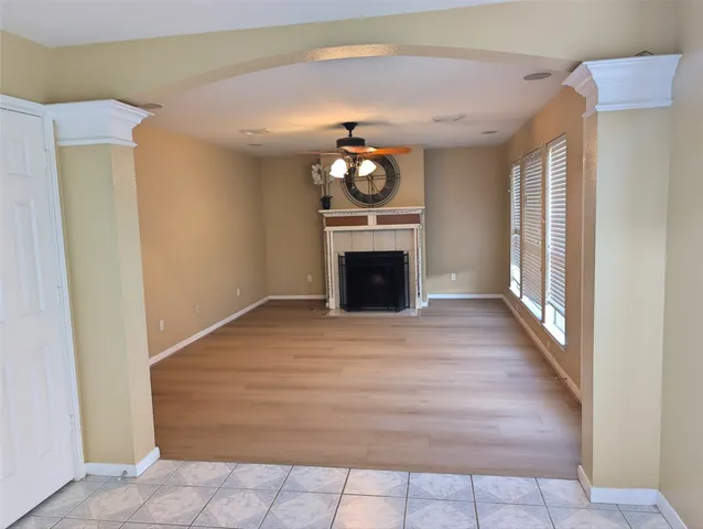 a bedroom with a bed and a fireplace