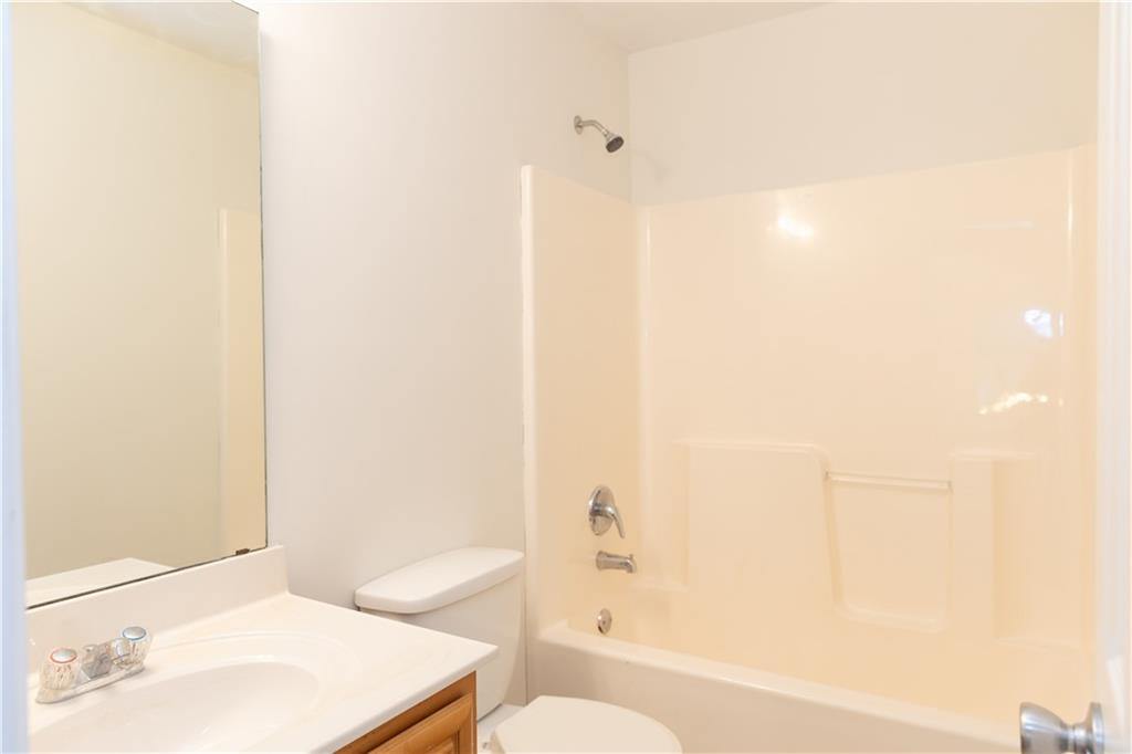 502 Streamside Place Canton, GA 30115 - Photo 26 of 33 a bathroom with a sink and a mirror