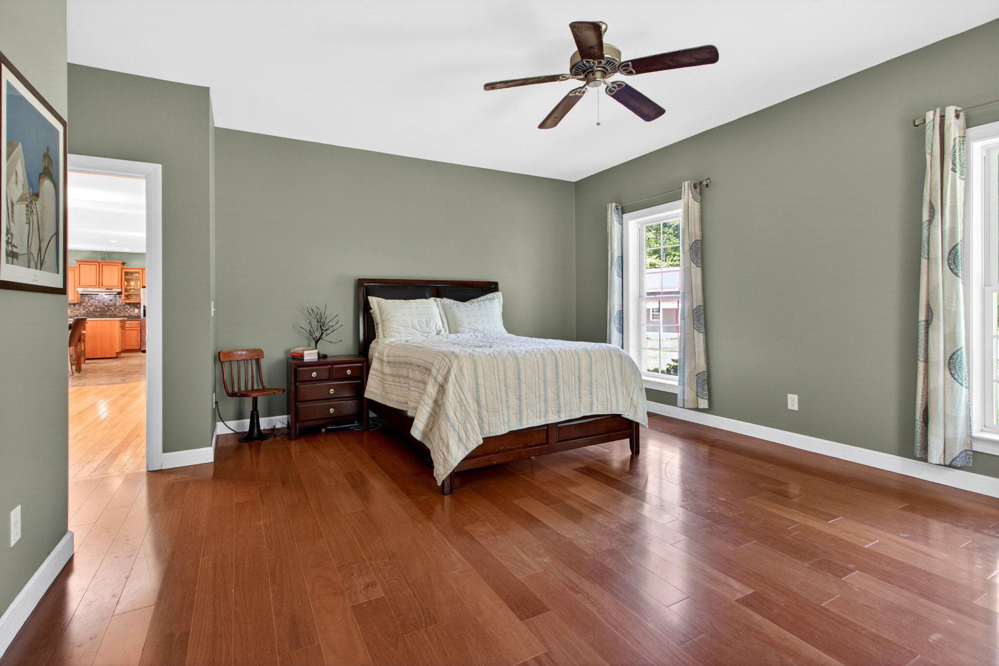 10878 Memory Road Harrington, DE 19952 - Photo 16 of 94 a bedroom with a bed and wooden floor
