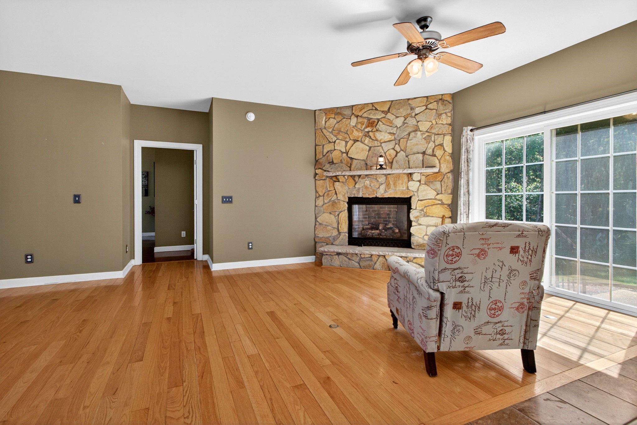 10878 Memory Road Harrington, DE 19952 - Photo 25 of 94 a living room with furniture and a fireplace