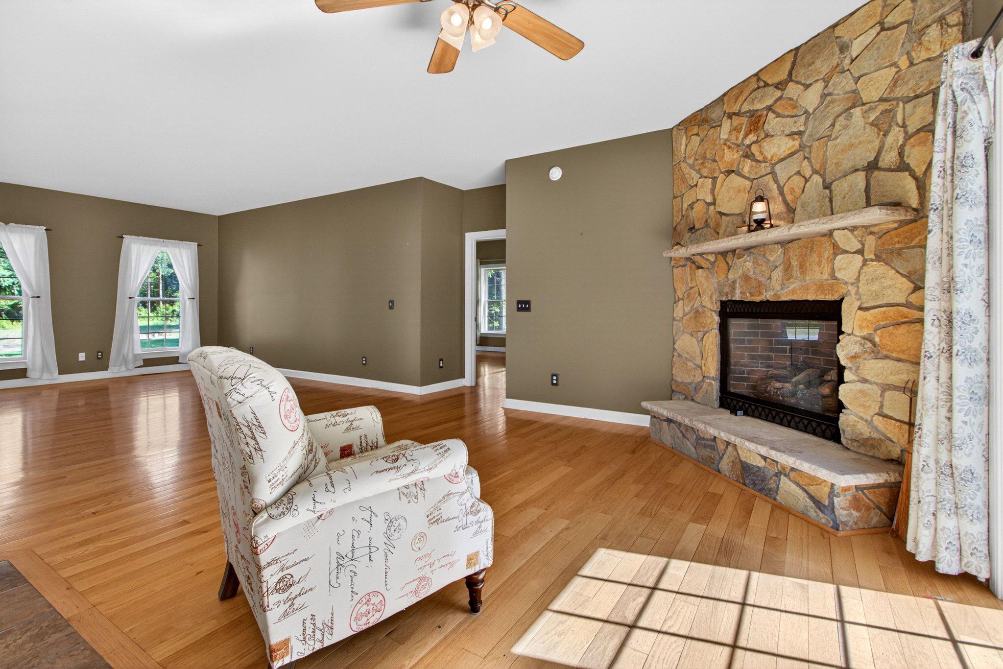 10878 Memory Road Harrington, DE 19952 - Photo 26 of 94 Spacious living area with stone fireplace.