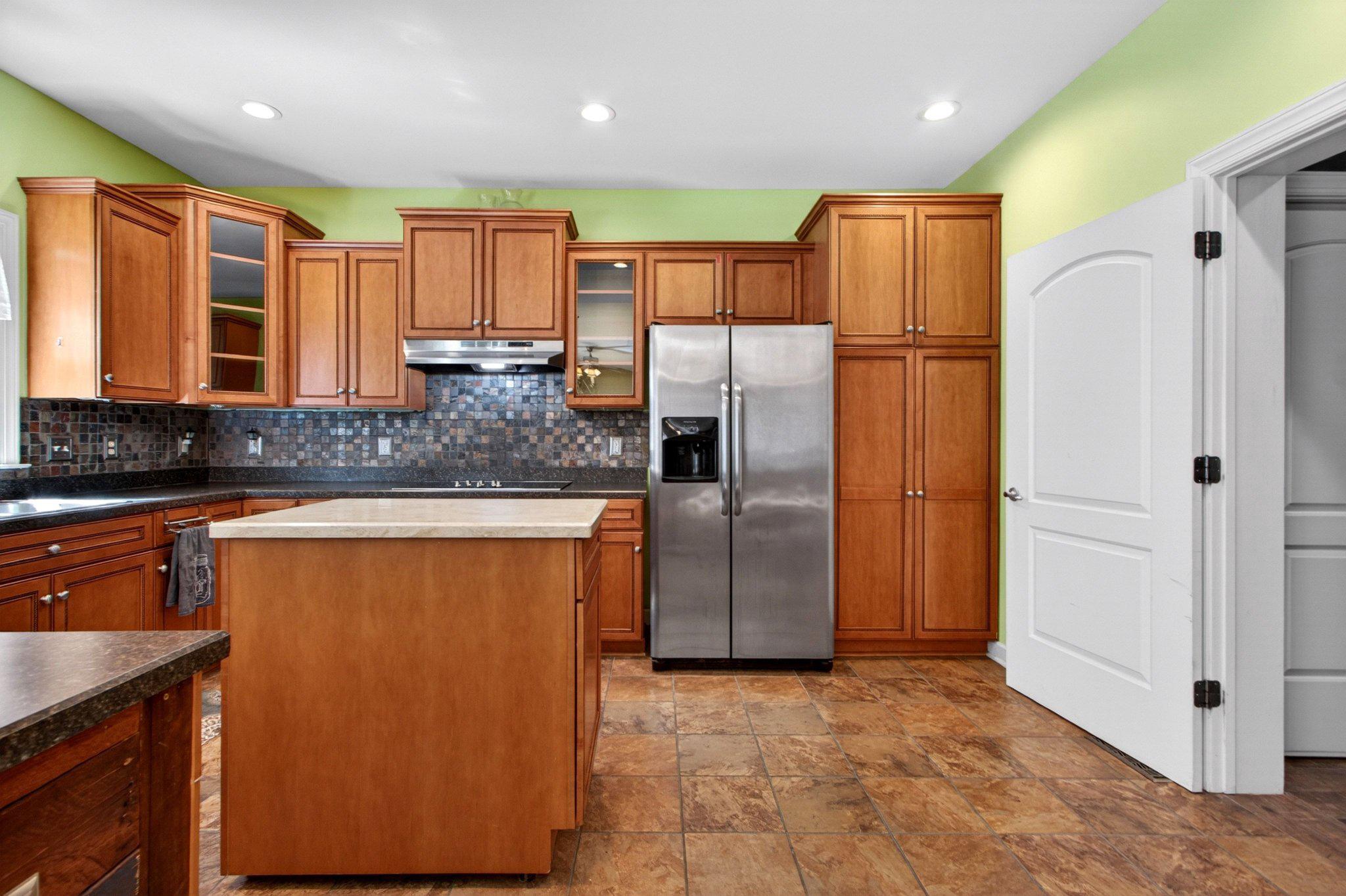 10878 Memory Road Harrington, DE 19952 - Photo 34 of 94 Modern kitchen with warm wood tones.
