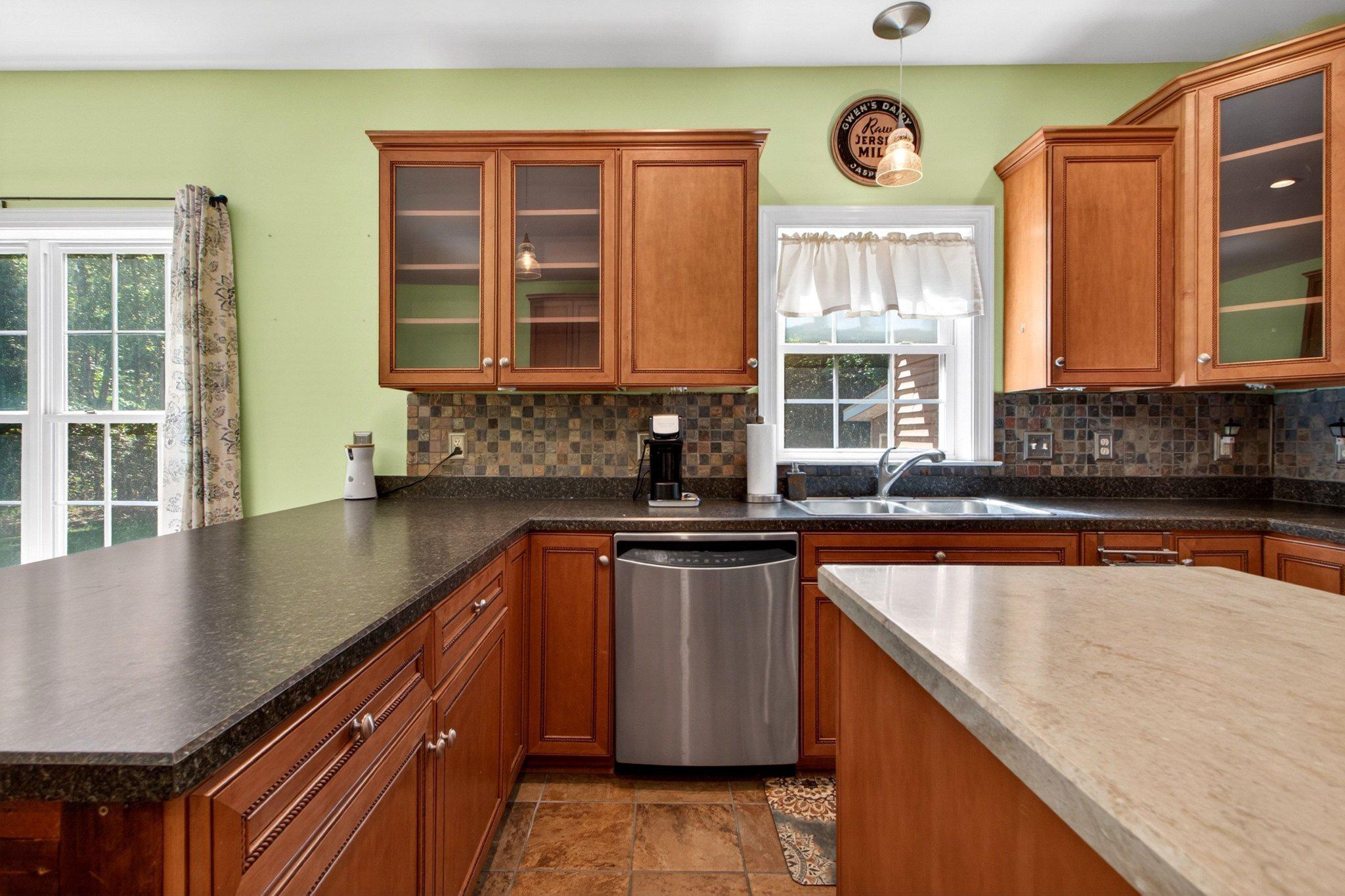 10878 Memory Road Harrington, DE 19952 - Photo 35 of 94 a kitchen with stainless steel appliances granite countertop a sink stove and cabinets