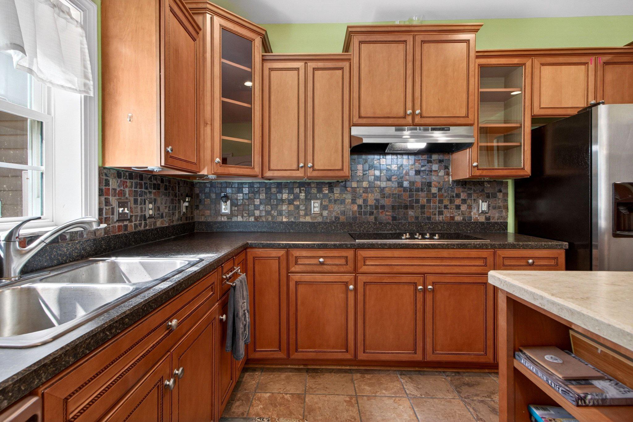 10878 Memory Road Harrington, DE 19952 - Photo 37 of 94 a kitchen with stainless steel appliances granite countertop a sink a stove and a refrigerator
