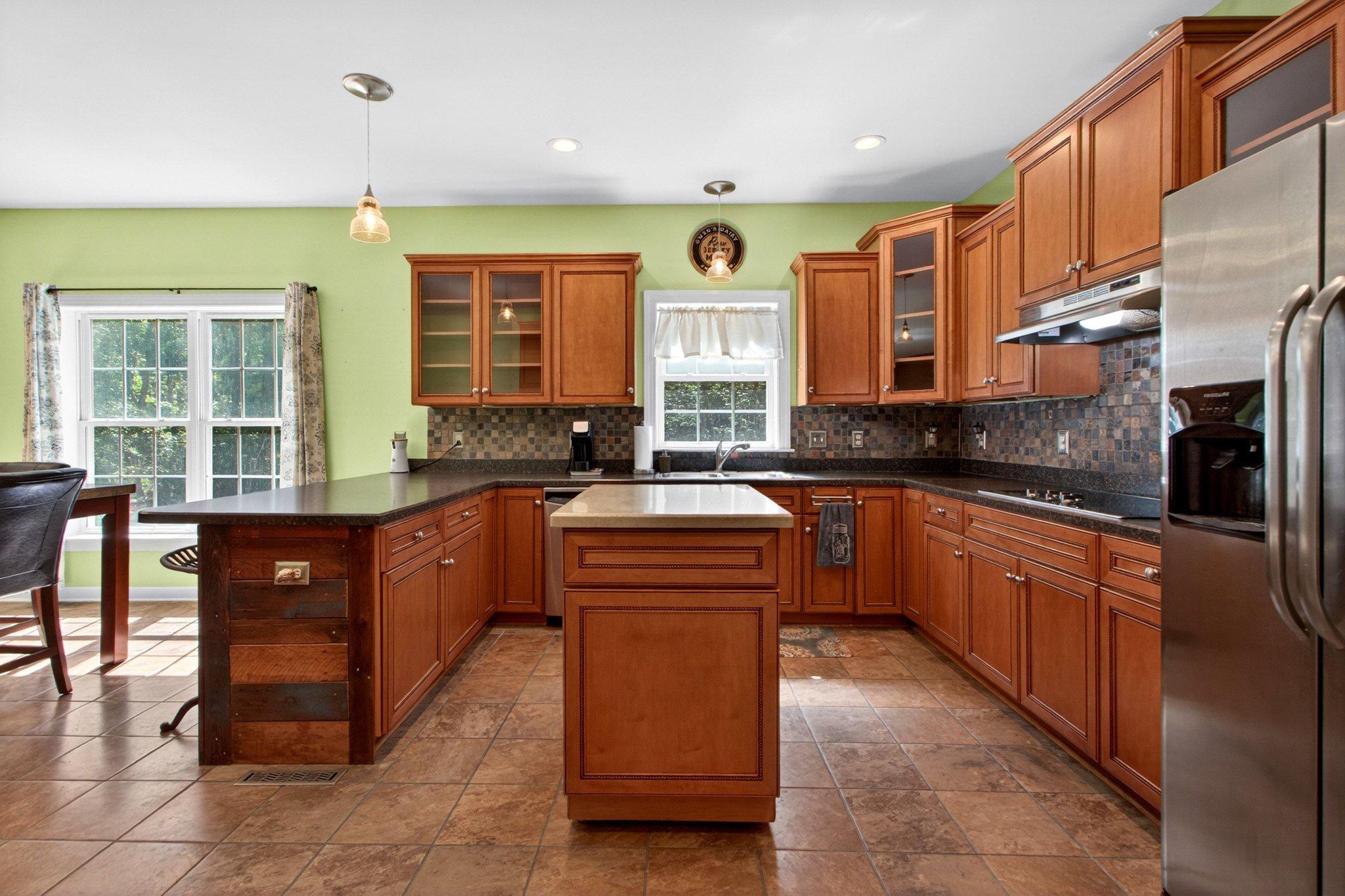 10878 Memory Road Harrington, DE 19952 - Photo 41 of 94 a large kitchen with stainless steel appliances granite countertop a stove a sink dishwasher and a refrigerator