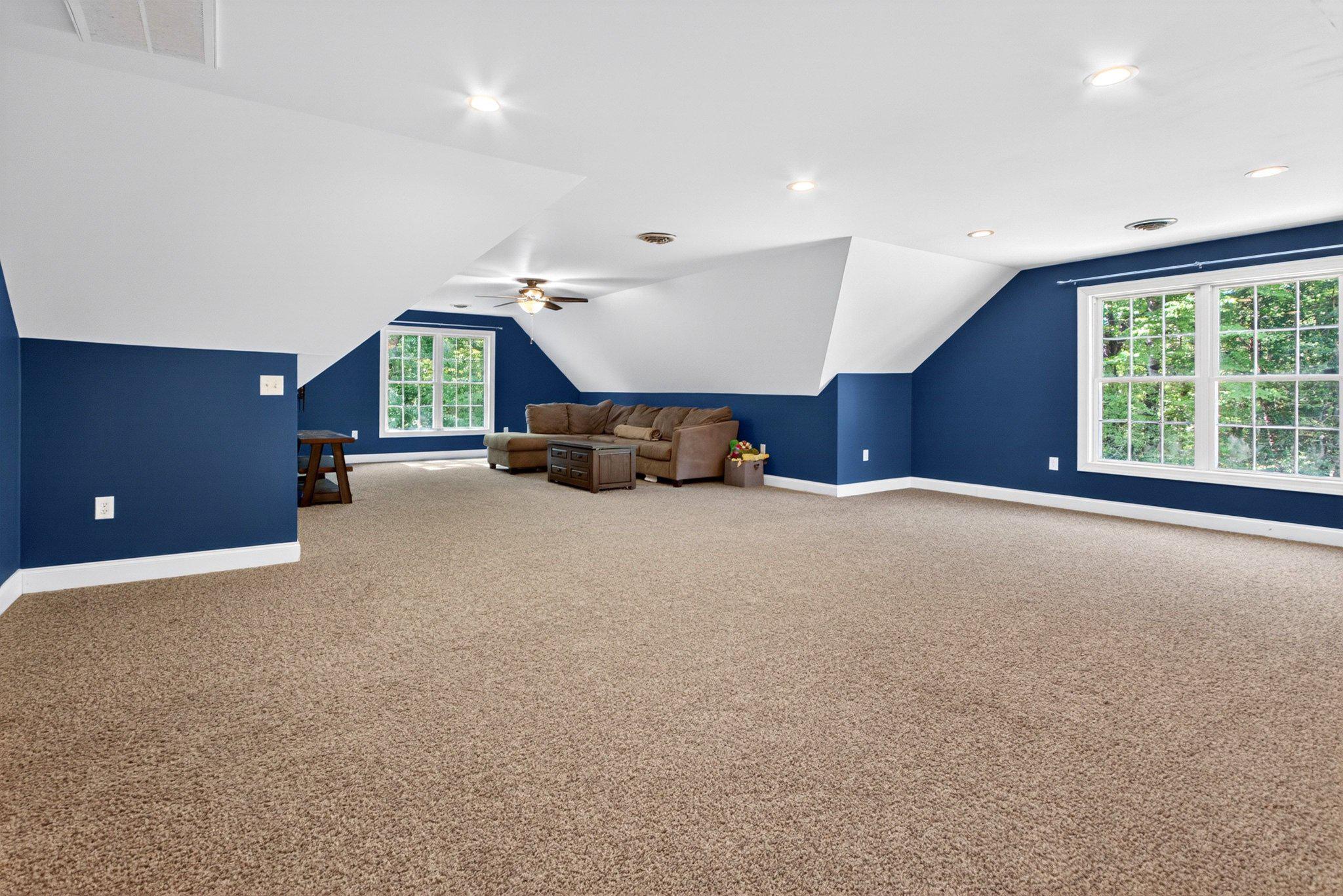 10878 Memory Road Harrington, DE 19952 - Photo 60 of 94 Spacious attic retreat with blue accents.