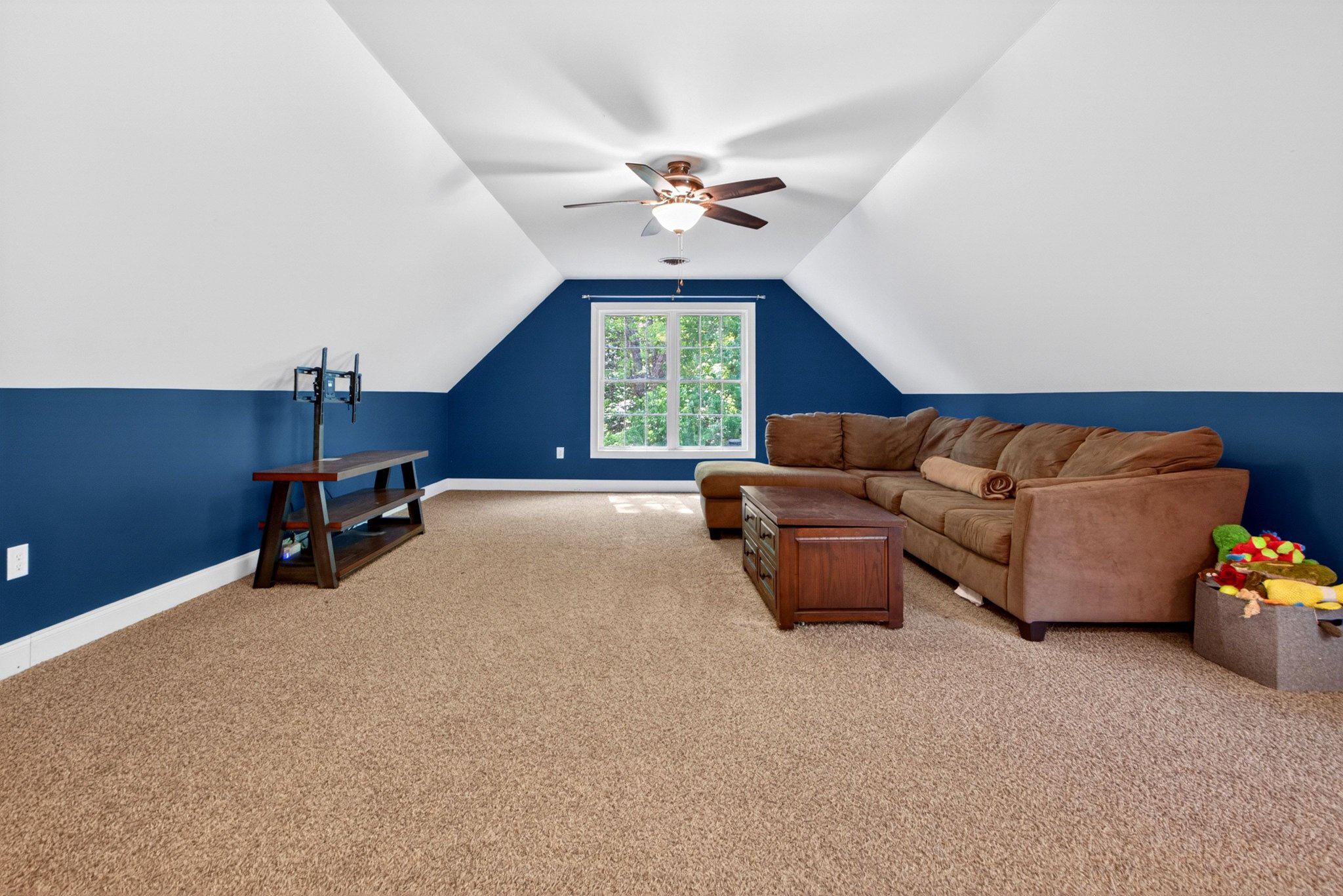 10878 Memory Road Harrington, DE 19952 - Photo 63 of 94 a living room with furniture ceiling fan and a window