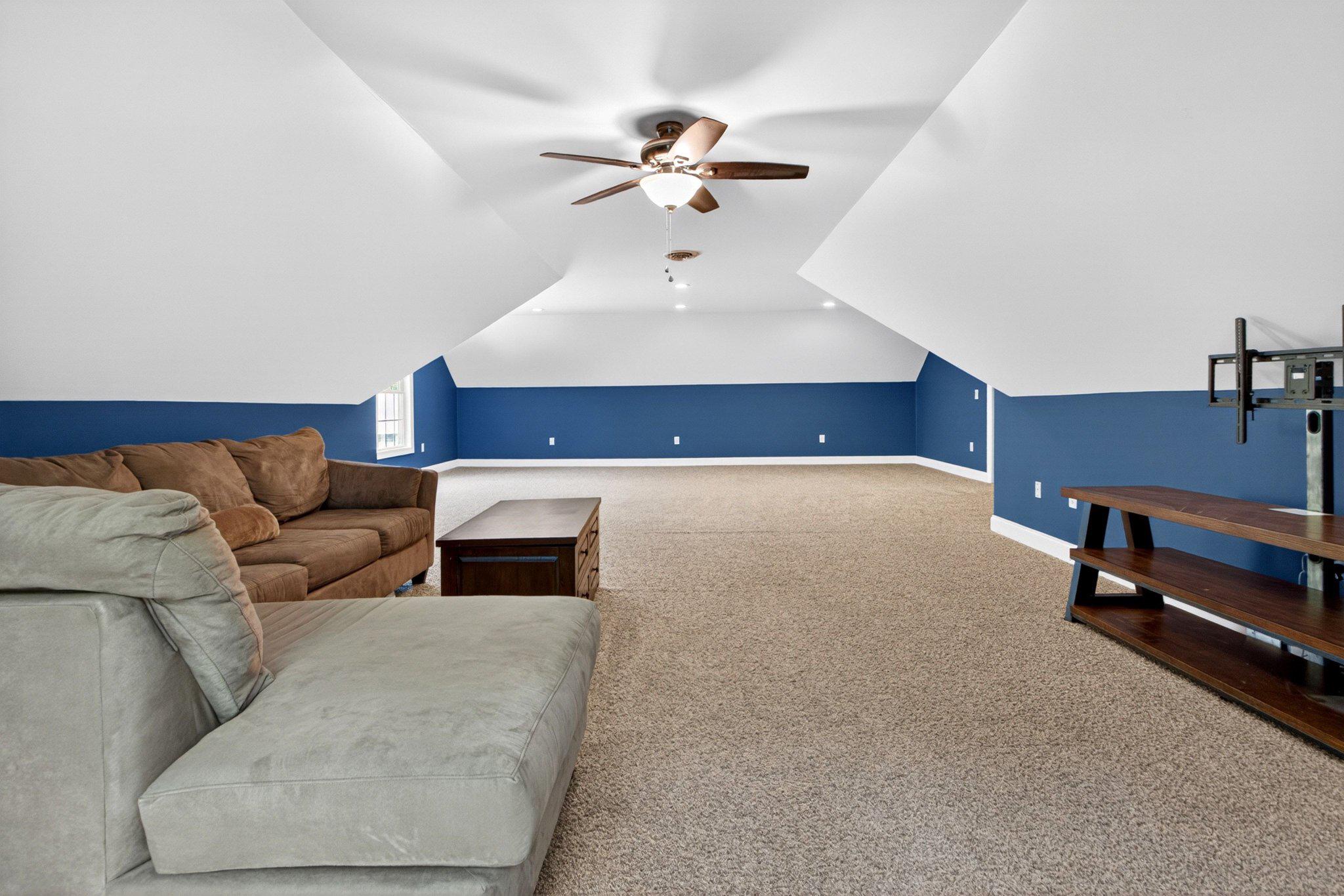 10878 Memory Road Harrington, DE 19952 - Photo 64 of 94 a living room with furniture and a chandelier