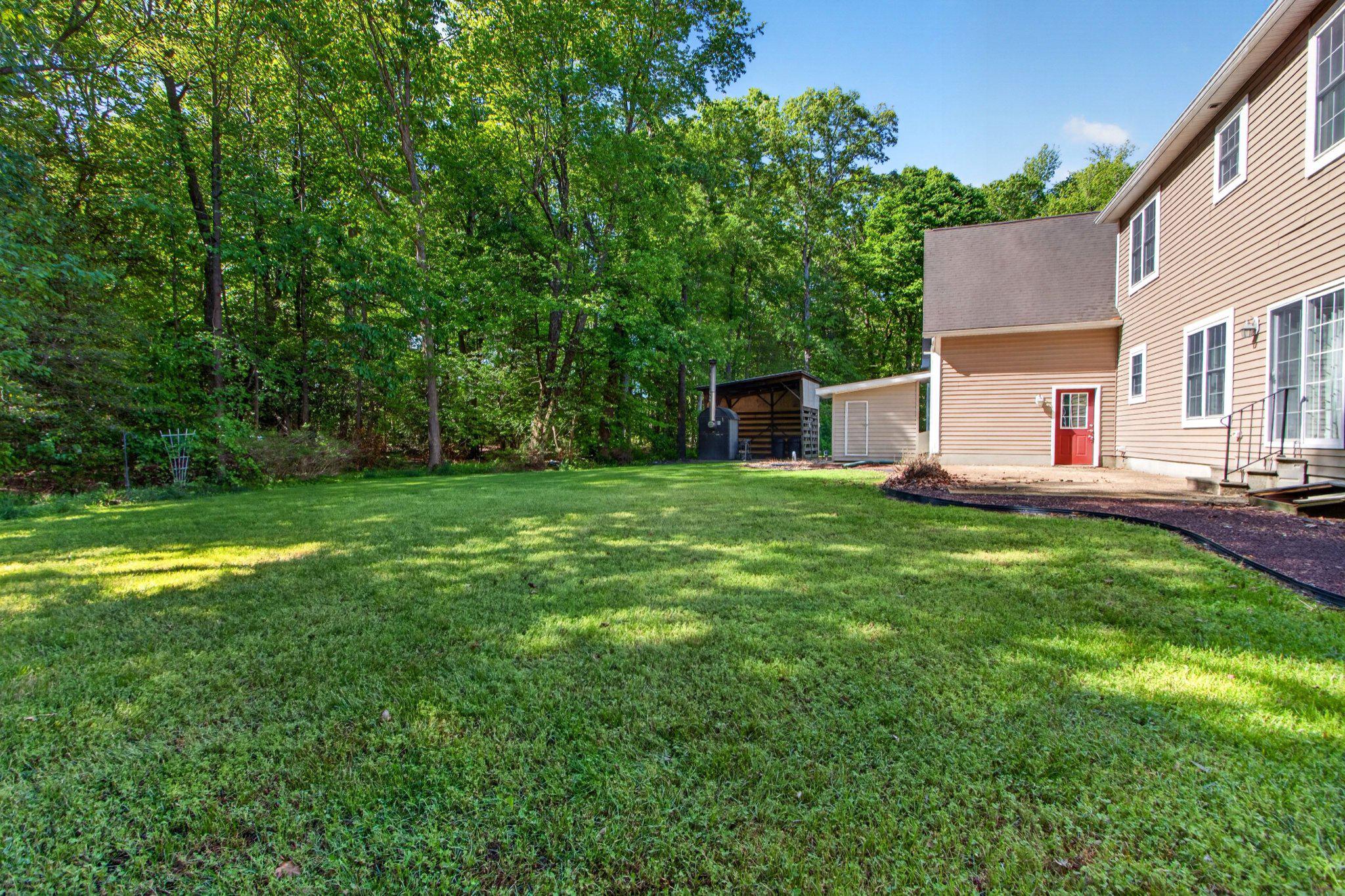 10878 Memory Road Harrington, DE 19952 - Photo 68 of 94 a view of a house with a backyard