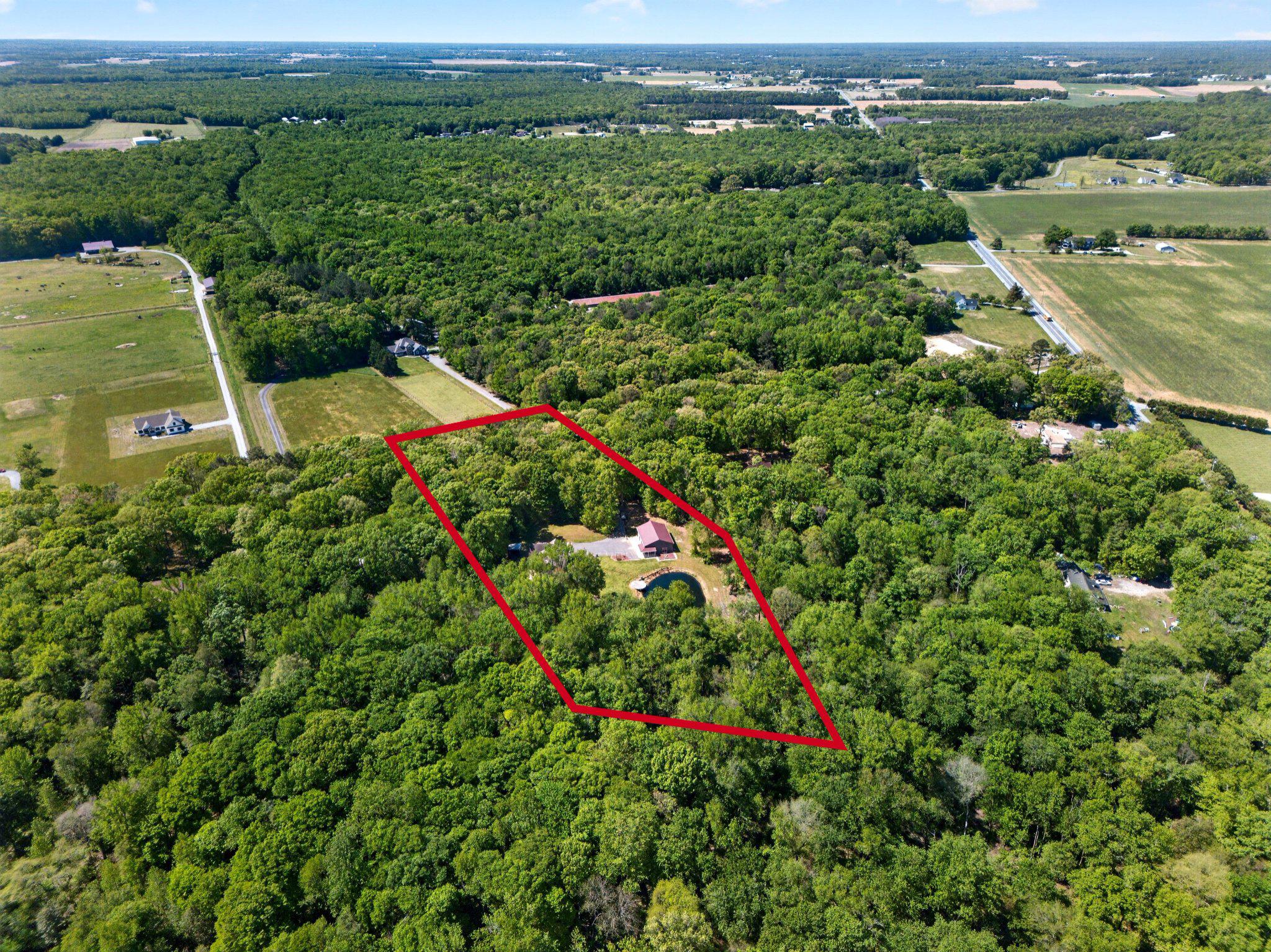 10878 Memory Road Harrington, DE 19952 - Photo 8 of 94 an aerial view of a house with a yard