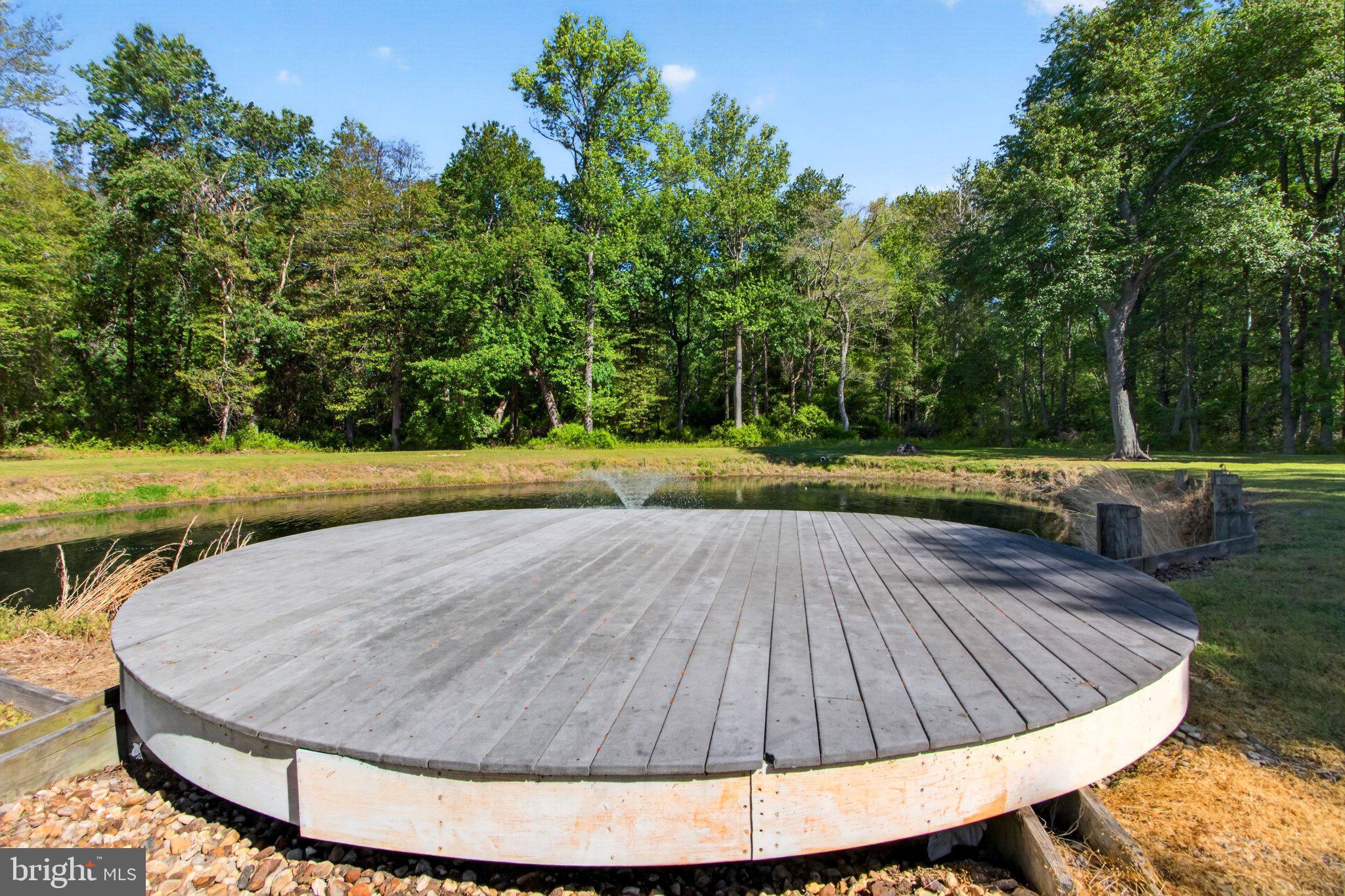10878 Memory Road Harrington, DE 19952 - Photo 86 of 94 Serene dock by a tranquil pond.