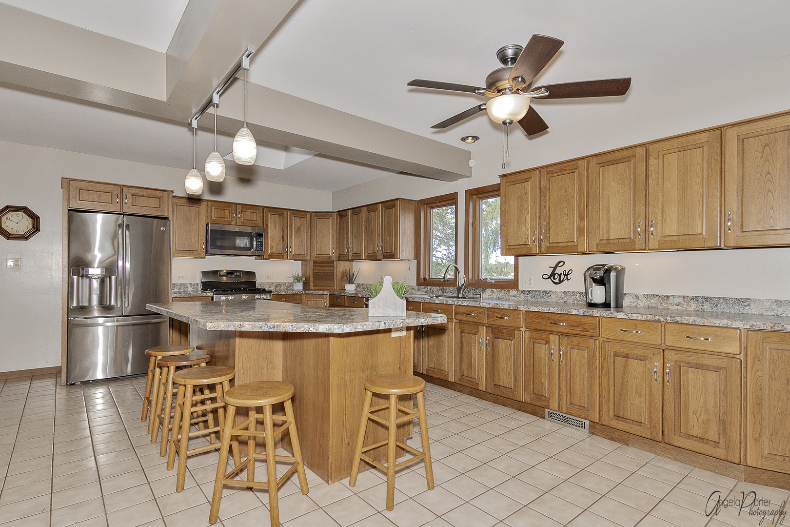 520 Bald Knob Road Johnsburg, IL 60051 - Photo 15 of 53 a kitchen with stainless steel appliances kitchen island granite countertop a sink and cabinets