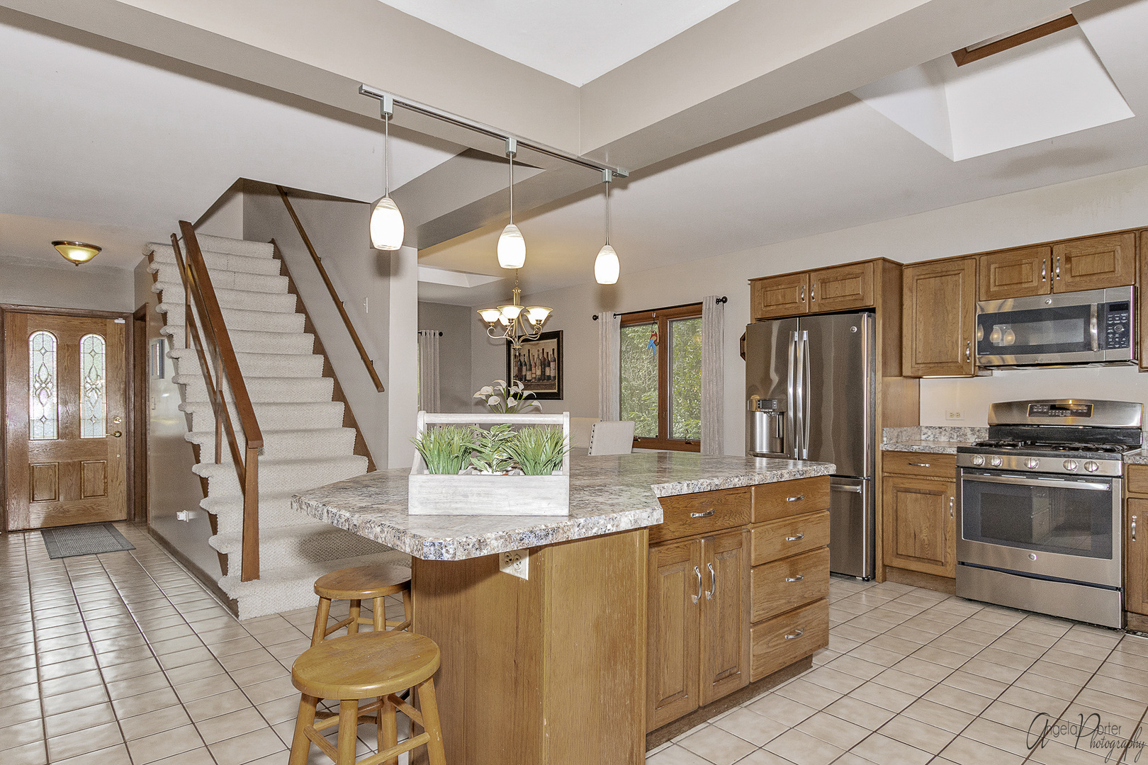 520 Bald Knob Road Johnsburg, IL 60051 - Photo 18 of 53 a kitchen with stainless steel appliances granite countertop a refrigerator and a stove top oven