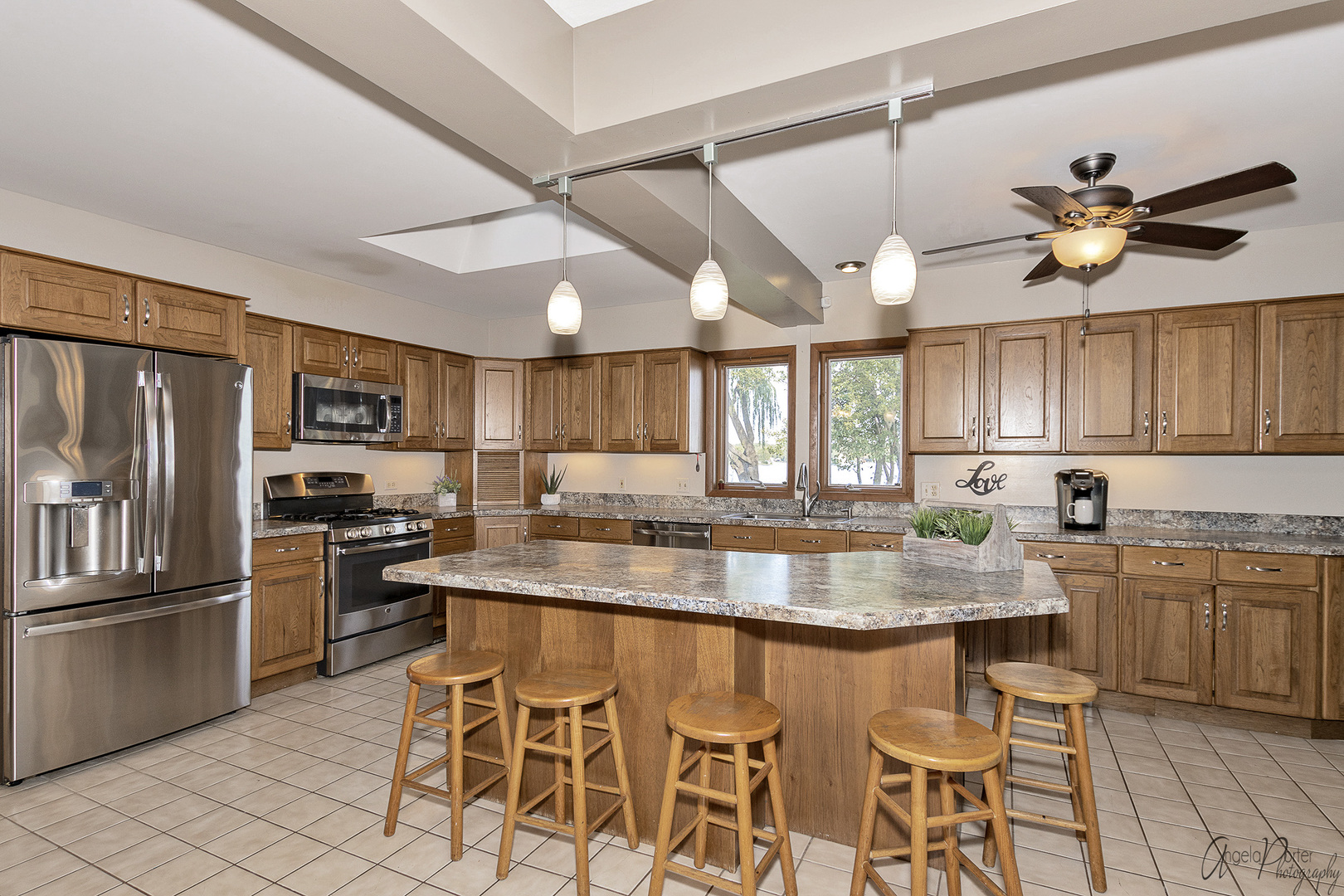 520 Bald Knob Road Johnsburg, IL 60051 - Photo 19 of 53 a kitchen with stainless steel appliances granite countertop a sink a stove and refrigerator